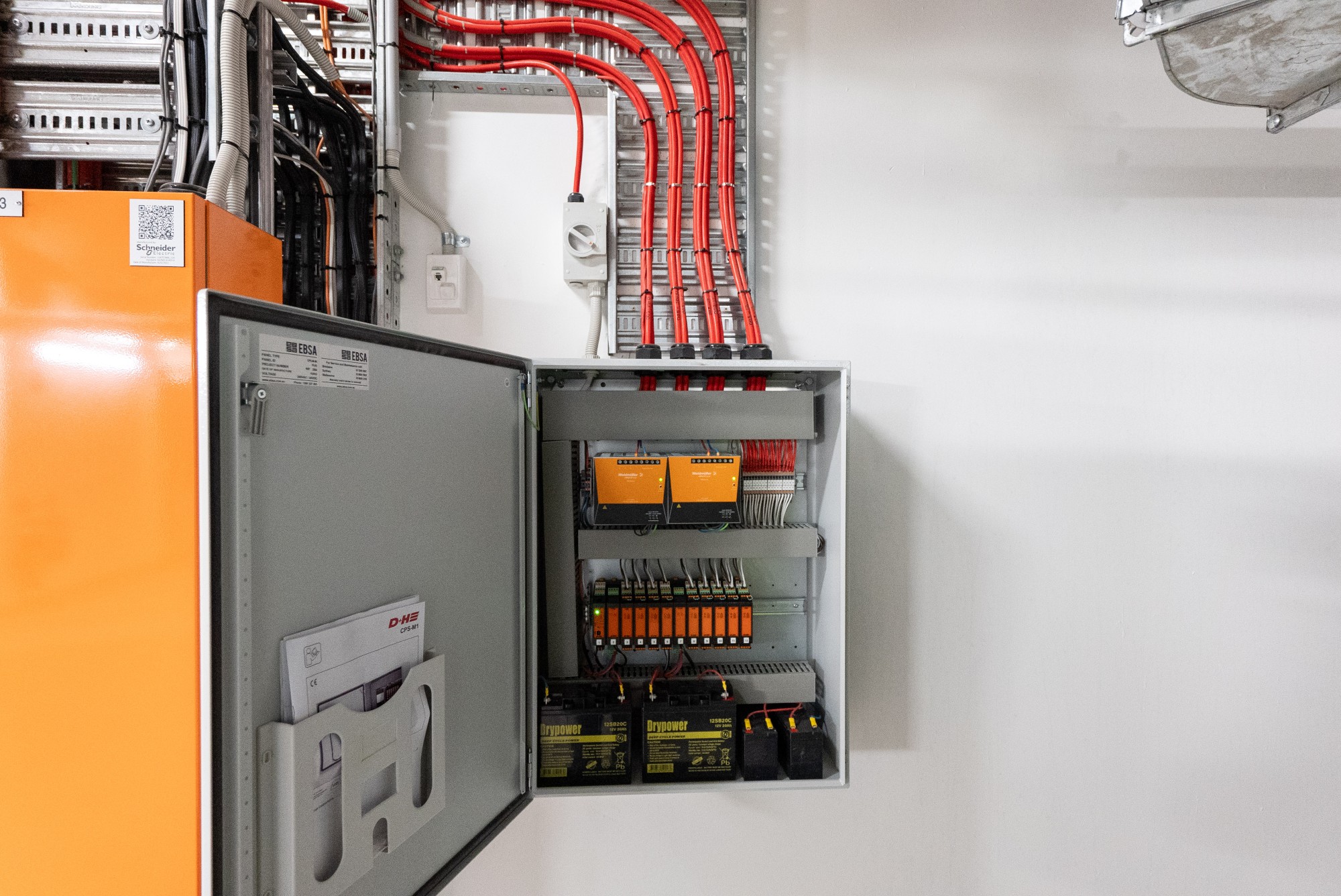 Open EBSA CPS-M louvre control panel at Marvel Stadium showing modular controls and battery backup